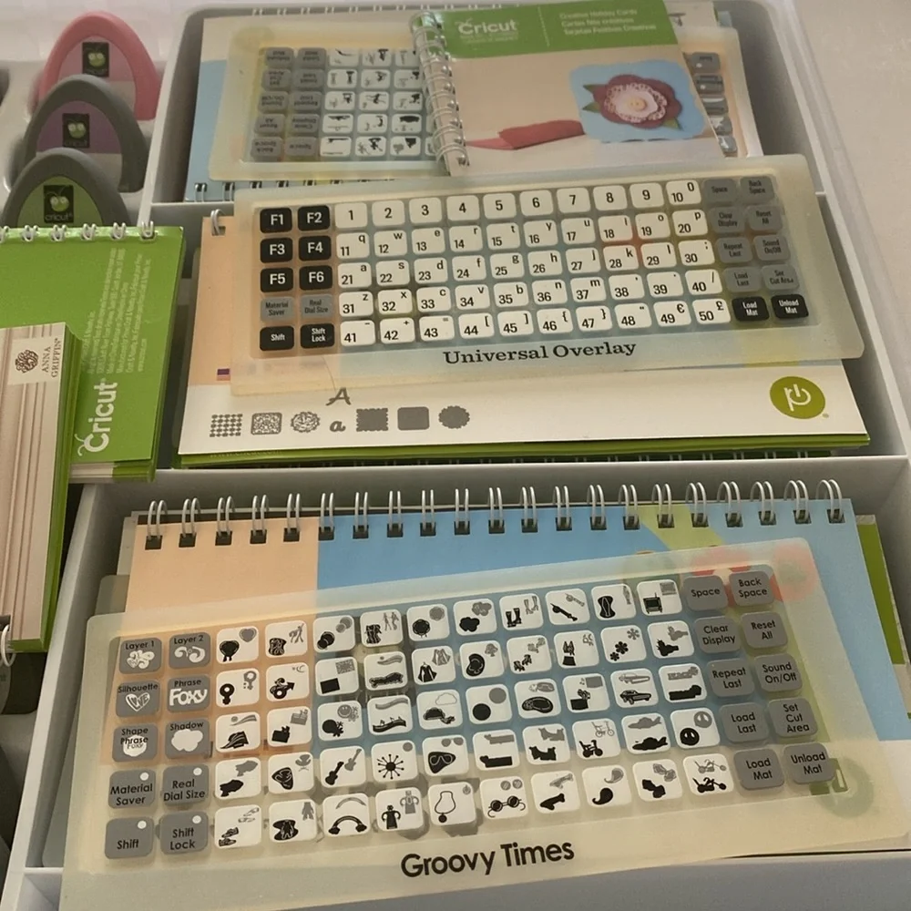 Cricut 19 Cartridges, 19 Booklets, 14 Overlay plus 1 Universal Overlay in case.